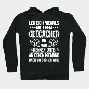 With a geocacher putting on geocaching Hoodie